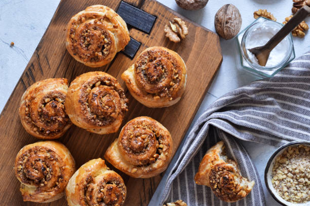 istock Snail buns with cinnamon and nuts on a concrete background. 1192931894