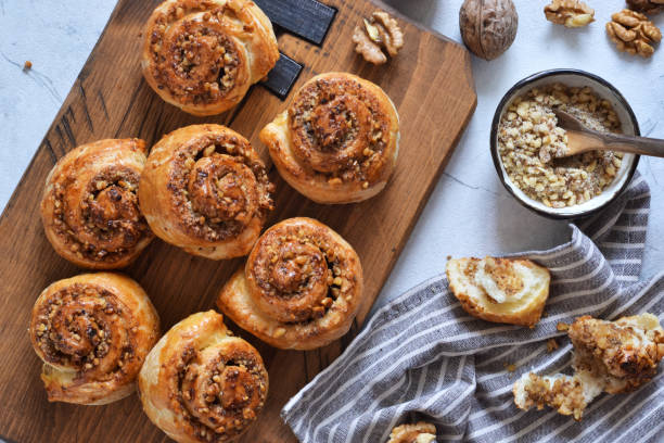 istock Snail buns with cinnamon and nuts on a concrete background. 1192931913