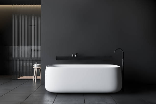 istock Dark gray bathroom with shower and tub 1192935652