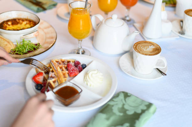 istock morning Breakfast or brunch in the restaurant. table with drinks and food. selective focus 1192936435