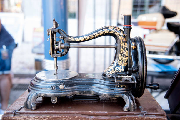 istock old sewing machine clothes in antique market 1192936463