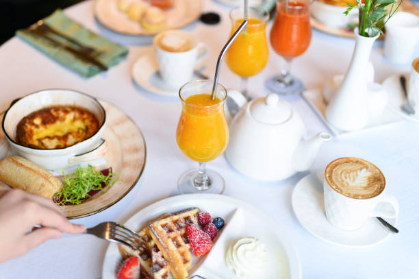 istock morning Breakfast or brunch in the restaurant. table with drinks and food. selective focus 1192936465