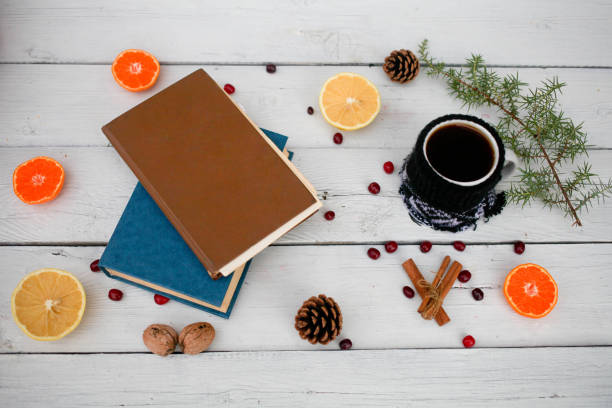 istock Cup of coffee with old book, 1192936918