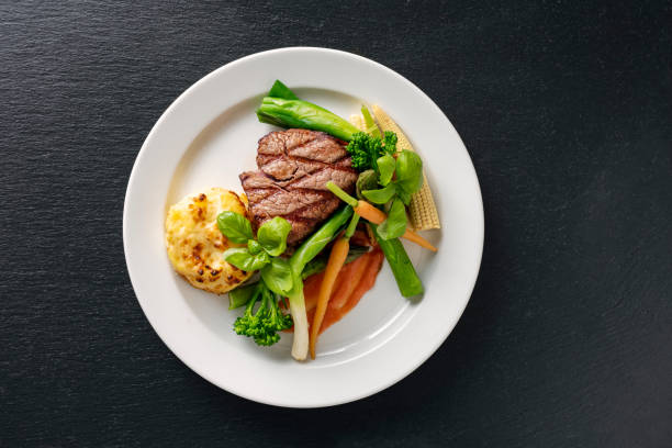 veal tenderloin with sesonal vegetables. - meat steak veal beef imagens e fotografias de stock