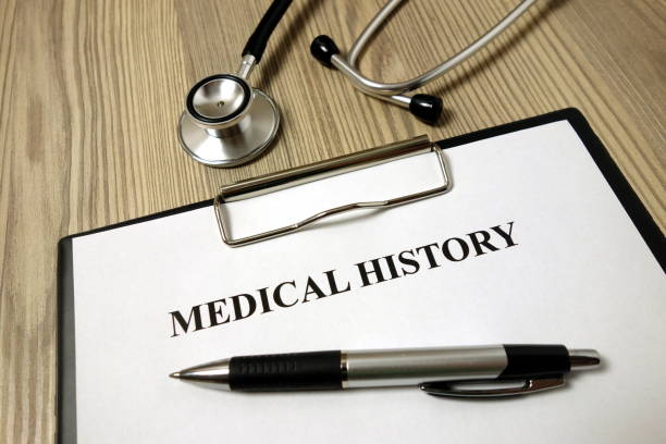 istock Medical history paper with pen and stethoscope 1192940303
