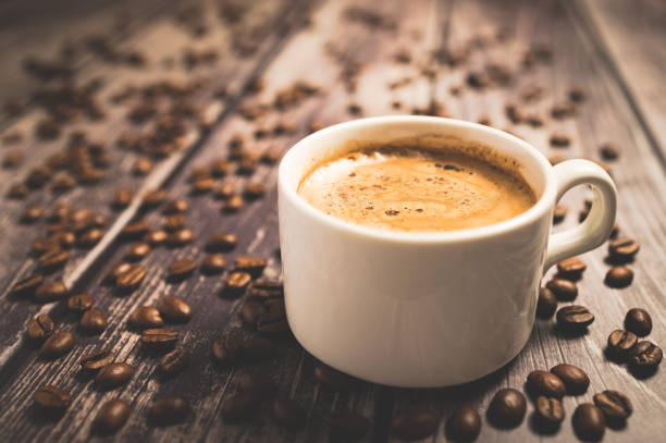 istock White cup with coffee on a wooden vintage table. 1192940882