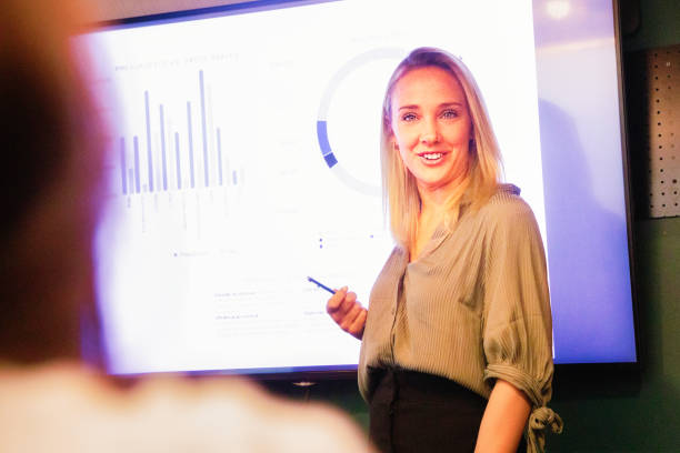 istock Young blond female manager answers a question with a smile 1192942022