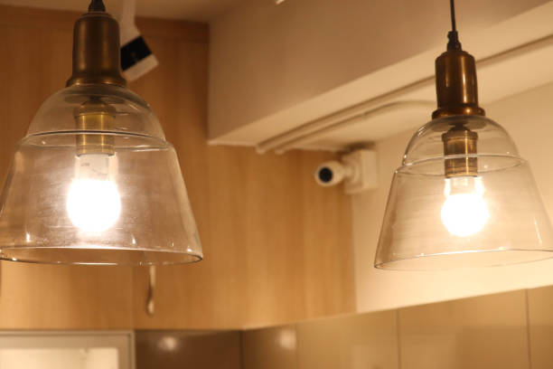 istock Selective Focus on Beautiful Interior Lighting With CCTV IPTV Camera in Defocussed Background 1192944889