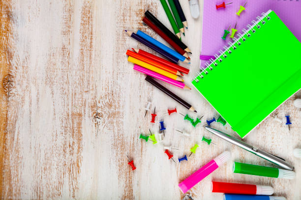istock Items for the school on a wooden table. 1192946183
