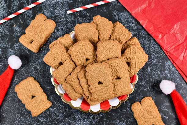 'Speculaas' or 'speculoos', a spiced thin, crunchy and caramelizedand shortcrust biscuit with figure stamped on the front side, traditionally baked in Europe in Christmas season