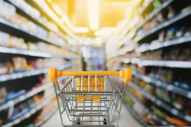 istock small shopping cart in grocery store 1192946525