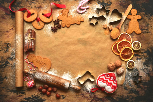 Christmas festive baking background with traditional ingredients and props for making ginger cookies Christmas festive baking background with traditional ingredients and props for making ginger cookies on a dark rustic wooden table. Top view with copy space. Cardamom stock pictures, royalty-free photos & images