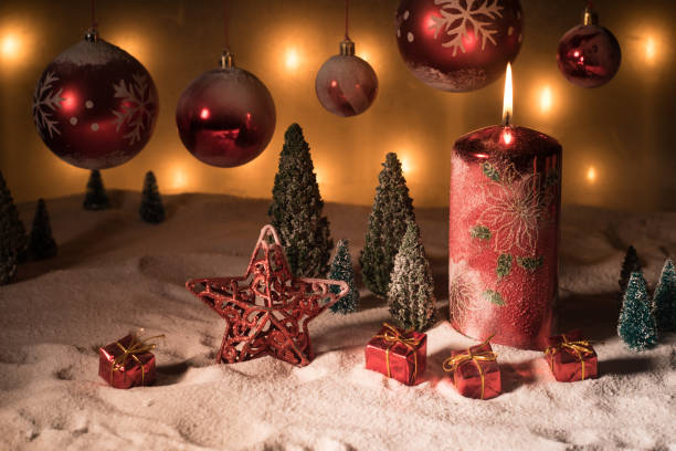 istock Creative artwork decoration. Christmas decoration with burning candles on a dark background. Christmas ornaments over dark golden background with lights. 1192948974