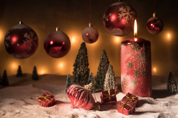 istock Creative artwork decoration. Christmas decoration with burning candles on a dark background. Christmas ornaments over dark golden background with lights. 1192948980