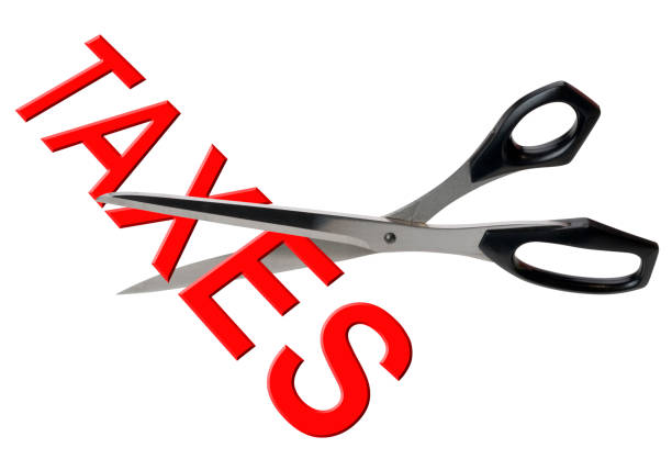 istock Scissors cutting taxes 1192949406