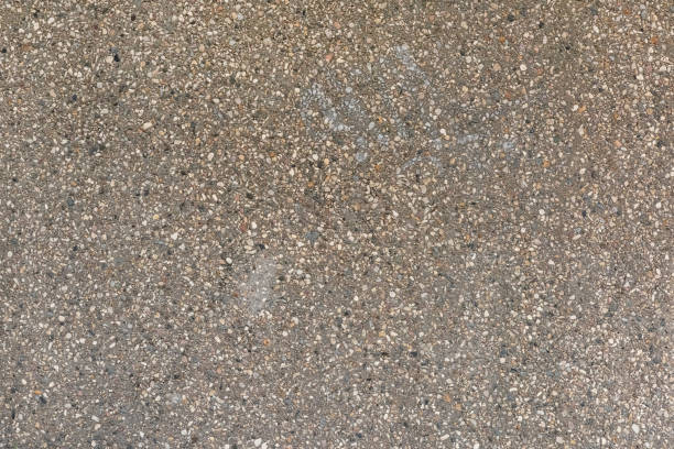 istock Asphalt with stone chips close-up. Empty background for layouts and sites. 1192949539