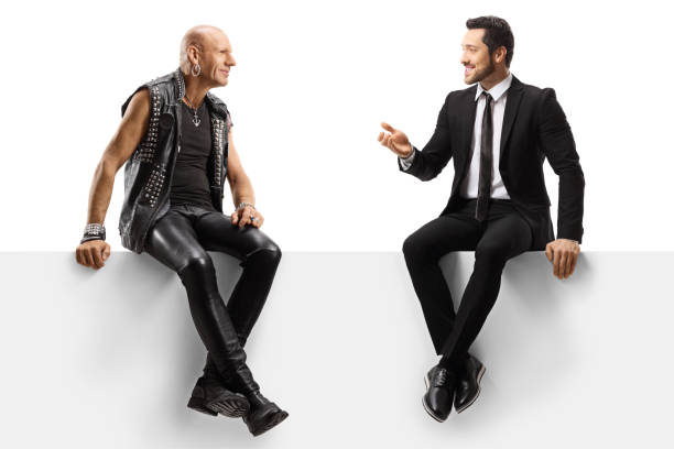 istock Punker and a businessman sitting on a panel and having a conversation 1192953823