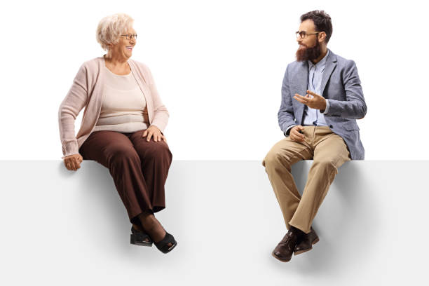 istock Senior woman and a bearded man sitting on a panel and talking 1192953859