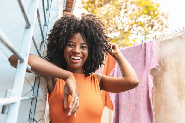 Portrait of beautiful brazilian afro woman relaxing outside the house Women, Afro, Brazil, Portrait, Day pardo brazilian photos stock pictures, royalty-free photos & images