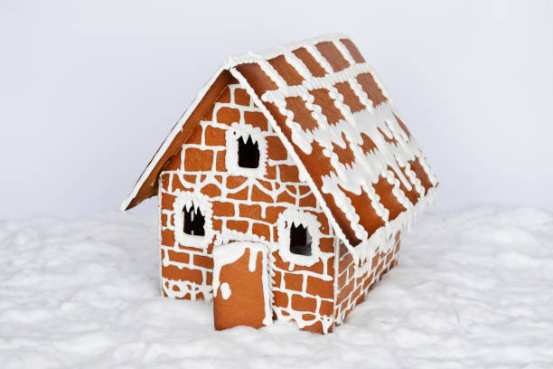 istock The hand-made eatable gingerbread house and snow decoration 1192953971