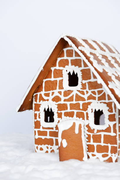 istock The hand-made eatable gingerbread house and snow decoration 1192953980