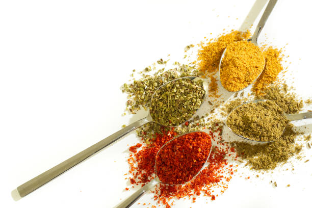 istock various spices. red pepper, black pepper and curry on white background 1192955251