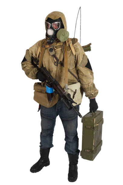 istock Stalker in gas mask with weapon 1192957137