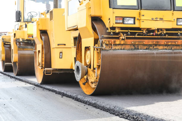 istock asphalt paving works in summer close up 1192960768