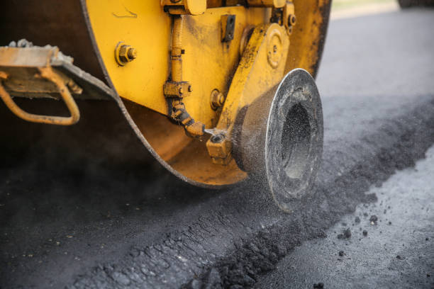istock asphalt paving works in summer close up 1192960800