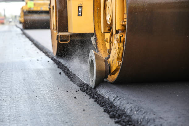 istock asphalt paving works in summer close up 1192960854