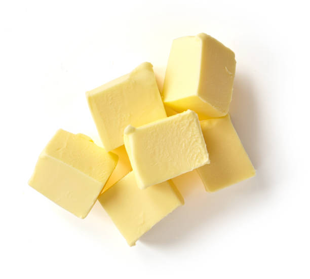 istock Pieces of butter isolated on white background, top view 1192961017