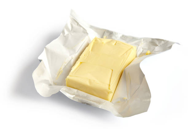 istock Piece of butter isolated on white background 1192961021