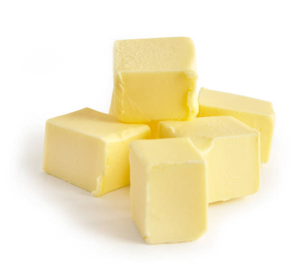 istock Pieces of butter isolated on white background, selective focus 1192961030