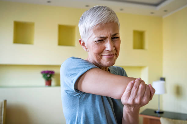 Mature Woman Having a Physical Problems After Home Exercise