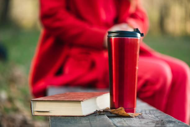 istock Red autumn still with book and thermos 1192964250