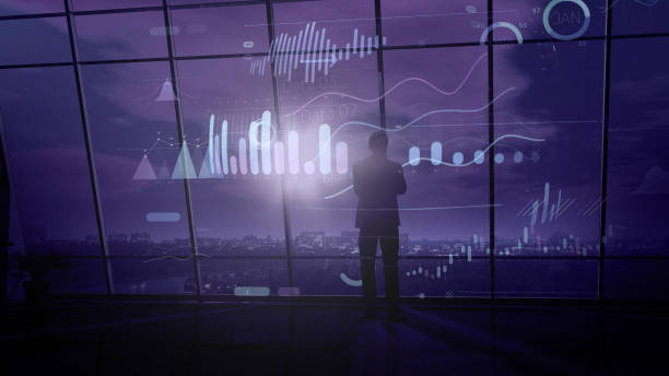 istock A businessman analyzes the hologram infographic data surrounded him. 1192967474