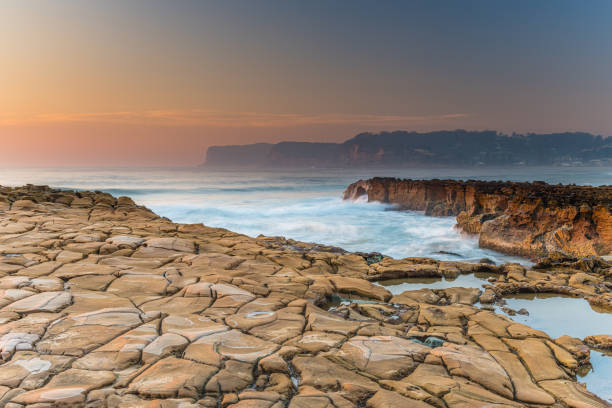 istock Smoke Haze and Sunrise from Tessellated Rock Platform 1192970046