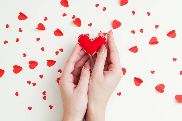 istock romantic feelings hands handmade felt heart love 1192980400