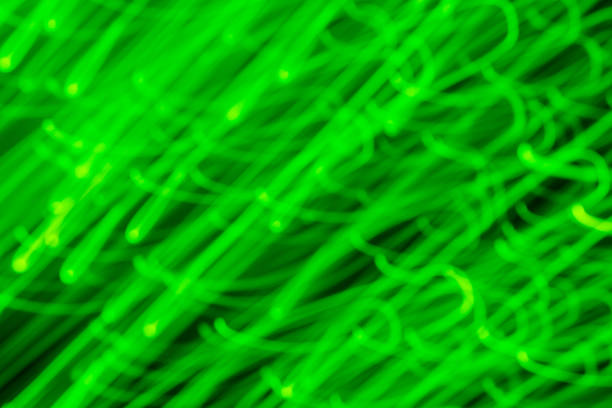 istock Futuristic blurred  lights holiday monochrome background in bright green neon 1192980405