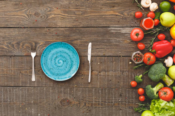 istock Fork, knife, near lie many vegetables 1192980602