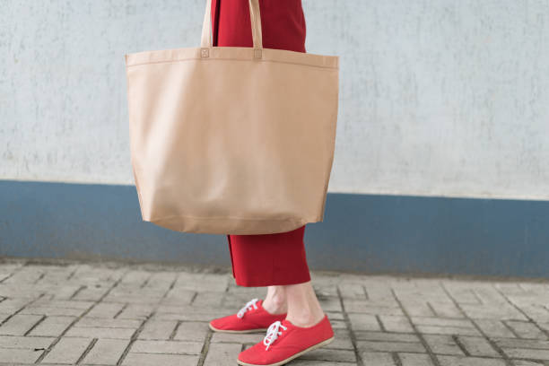 istock Big eco bag shopper. Young woman. Copy space 1192983337