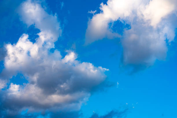 istock Blue sky with white clouds. Blue sky with black clouds. 1192986222