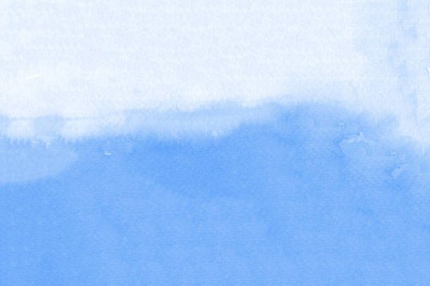 istock Watercolor texture on paper in blue color for background 1192990068