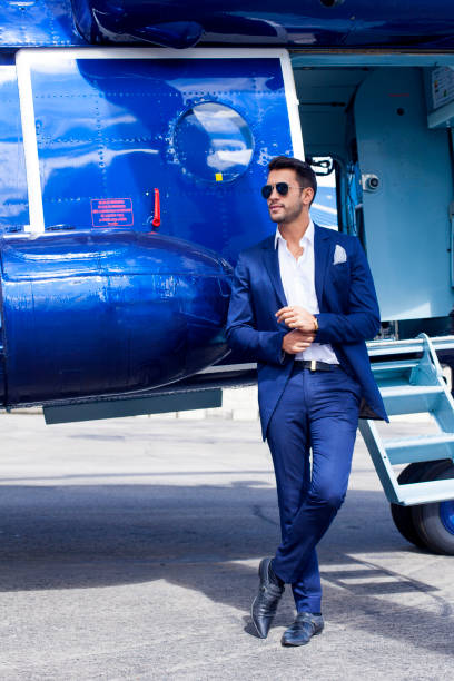 istock Man standing outside a helicopter 1192996683