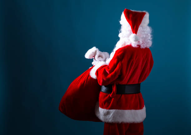 istock Santa holding a red sack 1192999328