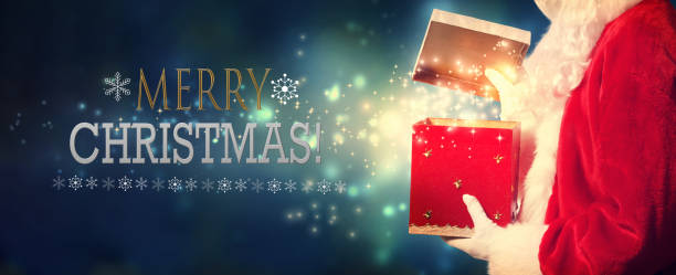 istock Merry Christmas message with Santa opening a gift box 1192999606