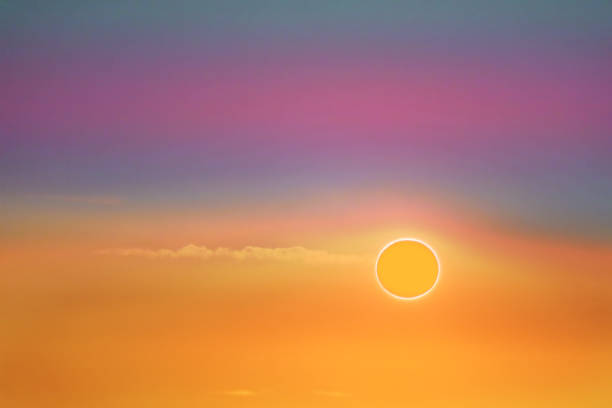 istock amazing phenomenon of total sun eclipse over soft cloud colorful sunset sky 1193003072