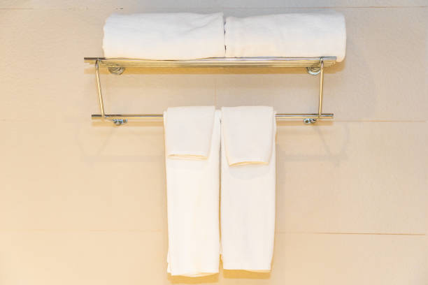 istock White comfortable towel on wall decoration in bathroom 1193005063