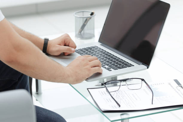 istock close up. businessman typing on a laptop 1193007051