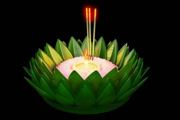 3d rendering of Thai traditional floating basket decoration by banana leaf and waterlily isolated on black background with clipping paths, for the ceremony in Loy Krathong Festival.